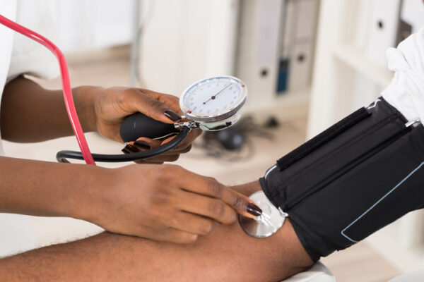 Doctor measuring blood pressure to patient in remote communities in Cape York